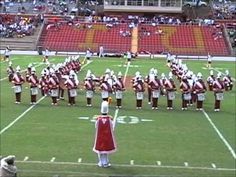 a marching band is performing on the field