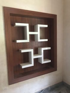 a wooden shelf with white shelves on it