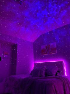 a bedroom with purple lighting and stars on the ceiling