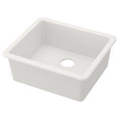 a white square sink with a hole in the middle and a drain on the side