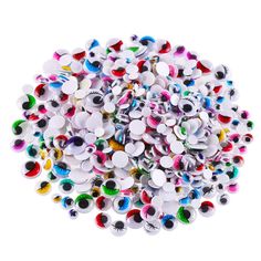 a pile of colorful buttons on a white background