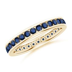 a yellow gold ring with blue sapphire stones