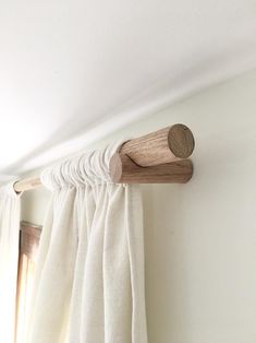 a curtain rod is hanging on the wall