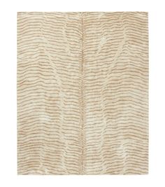 a beige and white rug with wavy lines