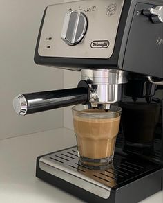 an espresso machine is being used to make cappuccino and coffee