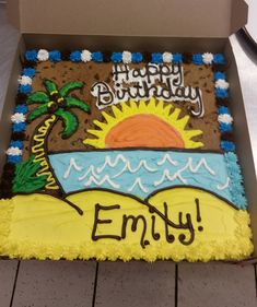 a decorated birthday cake in a box with the words, happy birthday envy on it