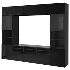 a black entertainment center with shelves and a white screen on the back wall, in front of a white background