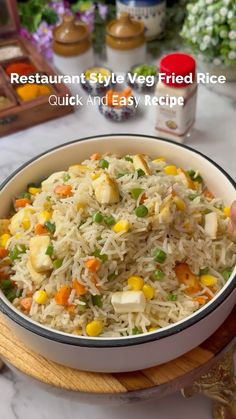 a white bowl filled with rice and vegetables