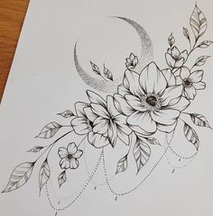 a drawing of flowers and leaves on a sheet of paper with the moon in the background