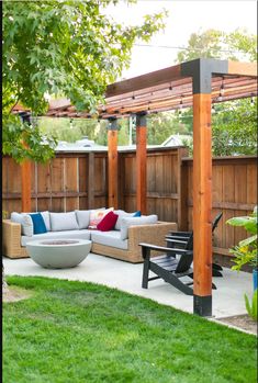 an outdoor living area with couches and tables