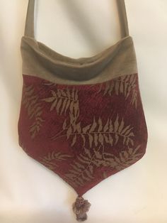 "Hello, Welcome to my shop, dedicated to up cycling decorator fabrics into functional  items for everyday use. This bag  is in a burgundy chenille with tan leaves mixed with a distressed tan  velvet trim and shoulder/cross body  strap and decorative tassel. Unique One of a Kind Chenille and Velvet Fabrics 9.5\"-10.5\" Wide x 12.5\" Tall 20\" Shoulder Strap Drop 4 Drop Pockets on Lining Hand Made in the USA" Velvet Fabrics, Tapestry Bag, Velvet Trim, Purse Patterns, Cute Bags, Cross Body Bag, Fabric Decor, Velvet Fabric, Body Bag