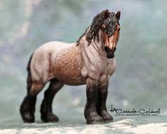 a toy horse standing on top of a table