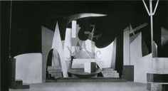 black and white photograph of an abstract sculpture in the middle of a room with no people