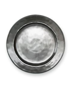 an empty metal plate on a white background