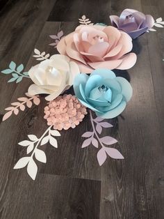 several paper flowers are laying on the floor