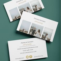 three business cards with photos on them sitting on top of a green table next to each other