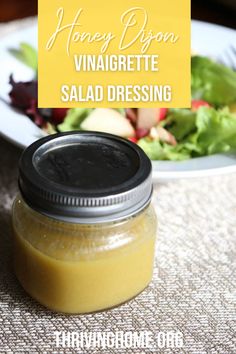 honey dijon vinaigrette salad dressing in a mason jar on a table