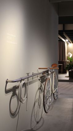 a bike is hanging on the wall in a room