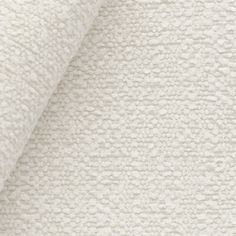 a close up shot of the textured fabric on a bed sheet that is white