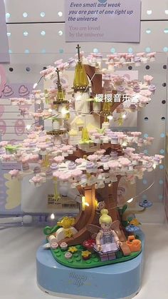 a lego tree is shown with its lights on