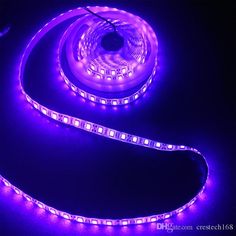 purple led strip light on black background