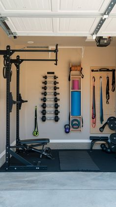 a home gym with equipment hanging on the wall and overhead storage rack for exercise gear