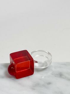 Vintage 1980's red and lucite acrylic ring. Size 8.5 Adjustable Vintage Ruby Ring, Vintage Adjustable Red Ruby Ring, Red Resin Ring Suitable For Gifts, Red Resin Rings Suitable For Gifts, Red Resin Rings As A Gift, Trendy Red Party Rings, Vintage Resin Rings For Gifts, Gift Red Resin Rings, Red Plastic Party Jewelry