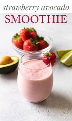 strawberry avocado smoothie in a glass with strawberries on the side