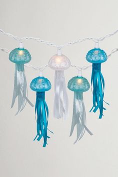 blue and white jellyfish lights hanging from a string