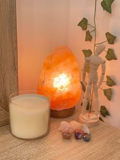 a candle and some rocks on a table