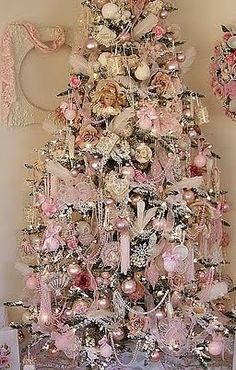 a christmas tree decorated with pink and white ornaments