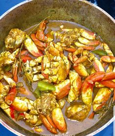 cooked crabs and other seafood in a pan