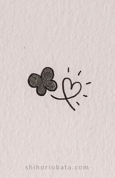 a drawing of a flower with a heart on it