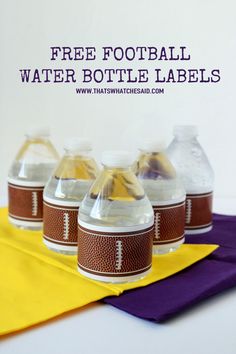 five bottles of water sitting on top of a purple and yellow cloth with the words free football water bottle labels