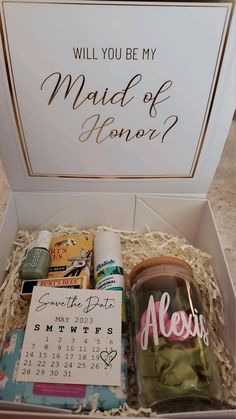 an open box with some items in it that says, will you be my maid of honor?