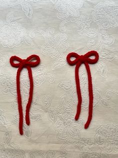 two red bows tied on top of each other