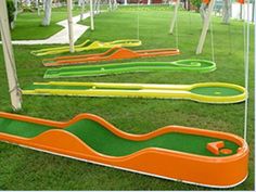 several different types of miniature golf courses on the grass