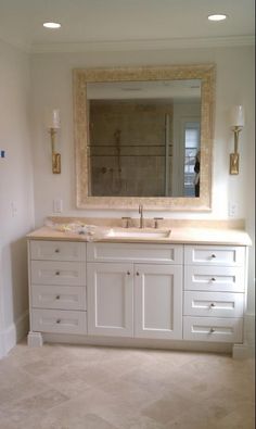 a bathroom with two sinks and a large mirror