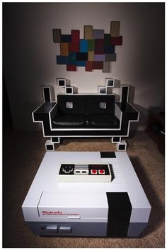 a nintendo game console sitting on top of a coffee table in front of a couch