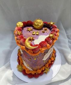 a heart shaped cake with sun and moon decorations