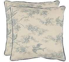 two blue and white pillows with birds on them