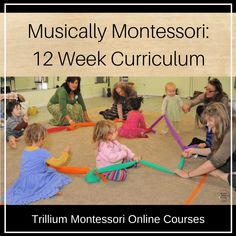 a group of children sitting on the floor in front of a sign that says musical montesso