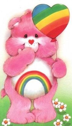 a pink teddy bear holding a rainbow heart balloon