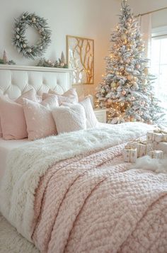 a bedroom decorated for christmas with pink and white decor