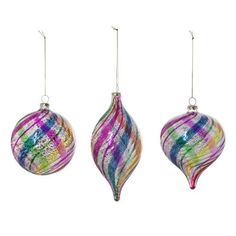 three glass ornaments hanging from strings on a white background, one is multicolored