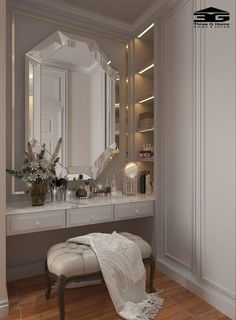 a bathroom with a vanity, mirror and stool in it's centerpieces