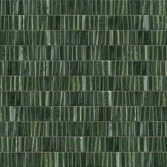 a green tile wall with vertical lines in the center and bottom half, all on one side