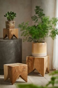 three wooden planters sitting next to each other