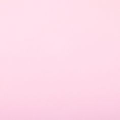 an airplane is flying in the sky on a pink background with copy space for text