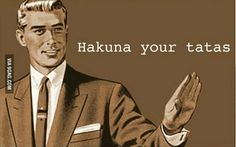 a man in a suit and tie holding his hands up with the words hakuna your tatas on it